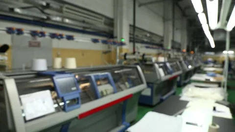 Blurred background view of working knitting machine in workshop. Stock Footage 258662444