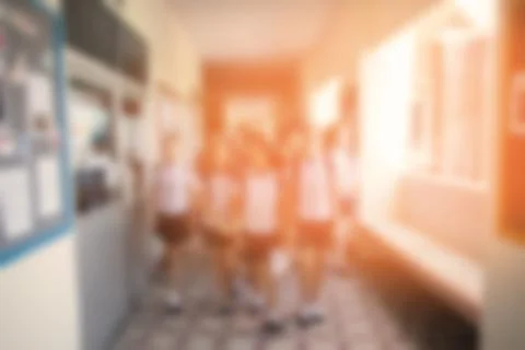 Blurred background of walkway in school building with students walking change Stock Photos