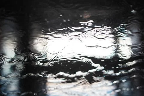 Blurred background of window sprayed with water. Stock Photos