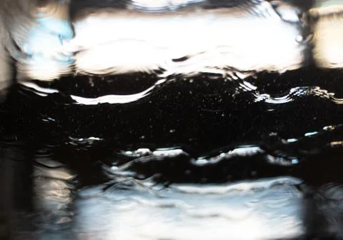 Blurred background of window sprayed with water. Stock Photos