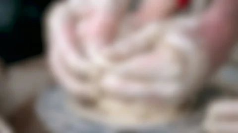 Blurred background. Workshop Molding of clay on a potter's wheel Stock Footage 140300898