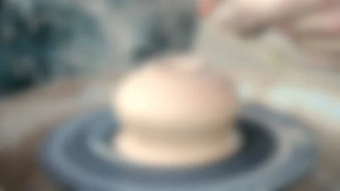 Blurred background. Workshop Molding of clay on a potter's wheel Stock Footage 140301196
