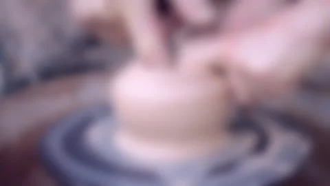 Blurred background. Workshop Molding of clay on a potter's wheel Stock Footage 140301218