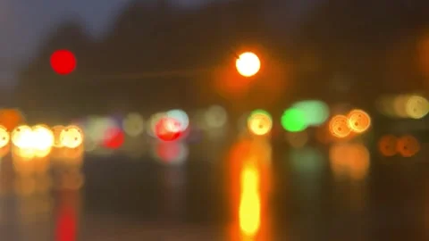 Blurred background with yellow, red, green bokeh lights, cars flow out of focus Stock Footage 343683537