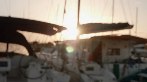 Blurred backlit image of yacht during sunset. Romantic evening Stock Footage 104345472