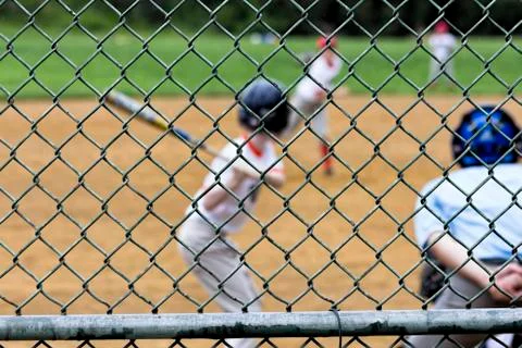 Blurred Baseball Game Seen Thru Backstop Stock Photos