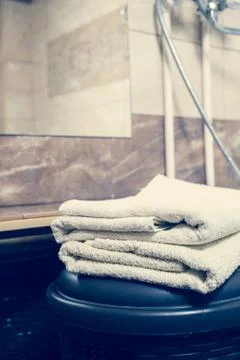 Blurred bathroom interior background and white spa towels on Marble Stock Photos