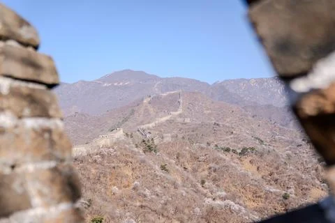 Blurred battlement edge framing distant mountain ridges Stock Photos