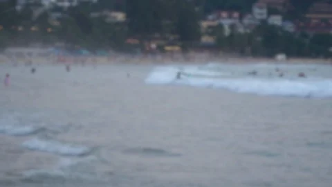 Blurred beach background on the shore with walking people in the evening. Stock Footage 120517725