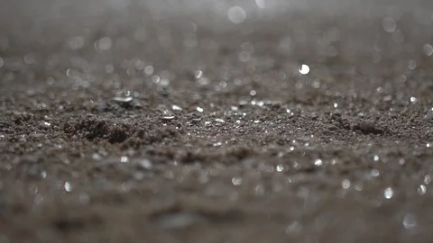 Blurred beach sand, close up panning shot abstract low angle view Stock Footage 100169157