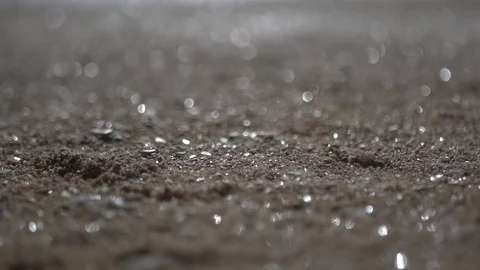 Blurred beach sand, close up panning shot abstract low angle view Stock Footage 100170338