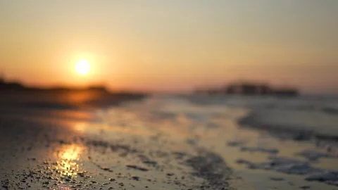 Blurred Beach Sunset with Sparkling Waves Stock Footage 319833625