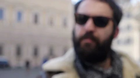 Blurred bearded man making no with finger in the street- slow motion Stock Footage 87397284