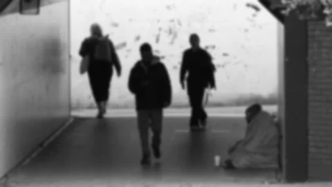 Blurred black and white subway/underpass with homeless man Stock Footage 272986218