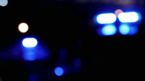 Blurred blinking blue lights reflection of police ship on the river Stock Footage 136240656