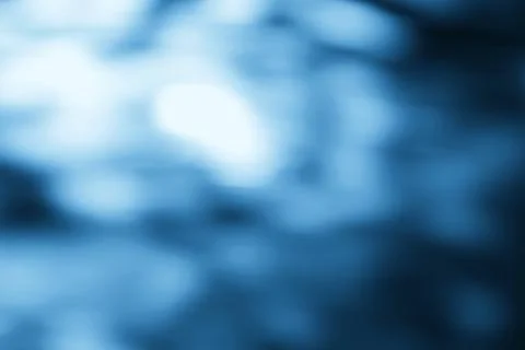 Blurred blue abstract background representing calm water or sky atmosphere Stock Photos