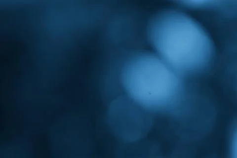 Blurred Blue Background with Bokeh Effect and Dark Shades Foto stock