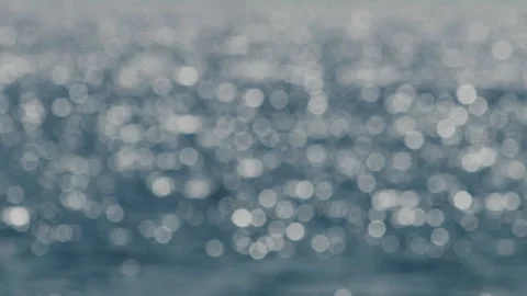 Blurred blue Bokeh ocean waves abstract background focus flickering Stock Footage 345008030
