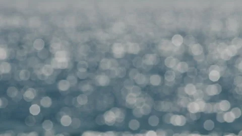 Blurred blue Bokeh ocean waves abstract background focus flickering Stock Footage 345008080