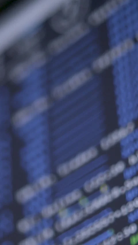Blurred Blue Computer Screen Displaying Digital Code and Data Stock Footage 323154282