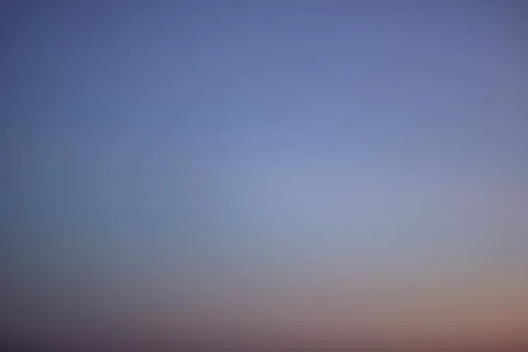 Blurred blue sky at sunset, graphient background Stock Photos