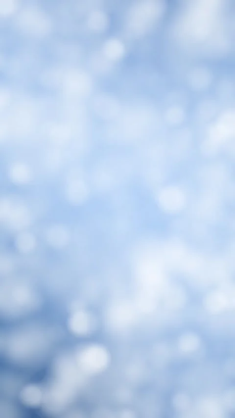 Blurred blue white winter circle bokeh looping animation Stock Footage 339714489