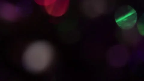 Blurred bokeh and colored lights in the dark 스톡 동영상 317455870