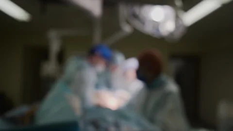 Blurred bokeh background of surgery in operating room of medical hospital clinic Stock Footage 124580155