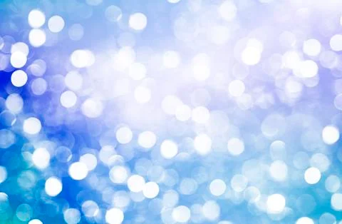 Blurred bokeh background, white circles, blue, festive background Stock Photos