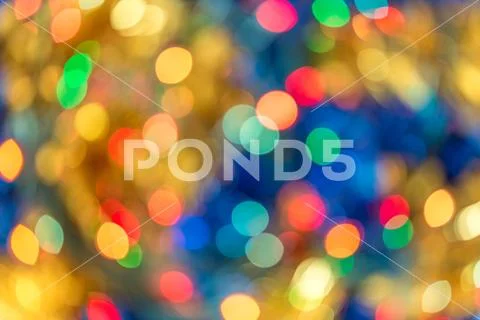Blurred bokeh christmas lights in warm tone background Stock Photos