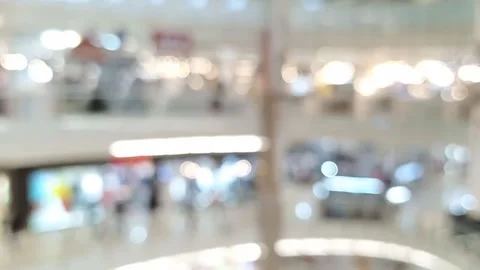 Blurred bokeh defocused background of large void inside Interior of a mall Stock Footage 147111485