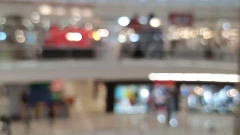 Blurred bokeh defocused background of large void inside Interior of a mall Video stock 147112801