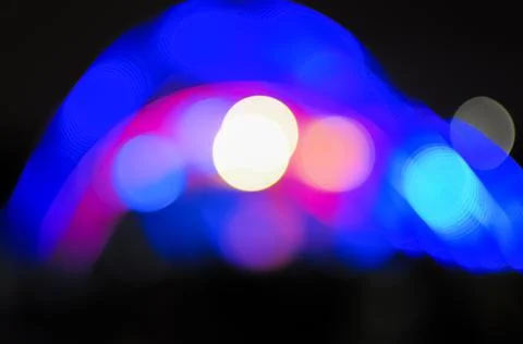 Blurred bokeh Light on a dark background. Stock Photos
