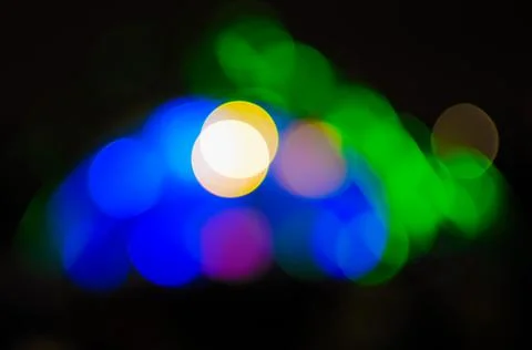 Blurred bokeh Light on a dark background. Stock Photos