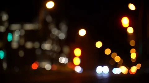 Blurred bokeh traffic on the road at night in the big city Stock Footage 106920793