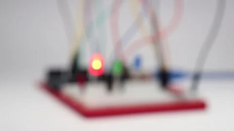 Blurred breadboard circuit with glowing led lights of RGB color Stock Footage 334123070