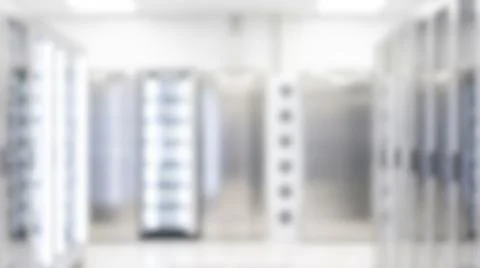Blurred bright modern data center room featuring metal server racks contain.. Stockfoto's
