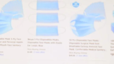 Blurred browsing on internet  in search of disposable mask coronavirus outbreak Stock Footage 126245217