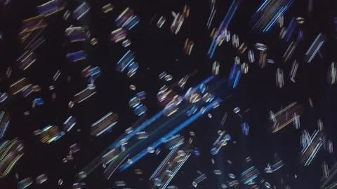 Blurred bubbles falling through the night sky. Stock Photos