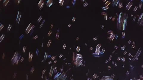 Blurred bubbles floating through the night sky. Stock Photos
