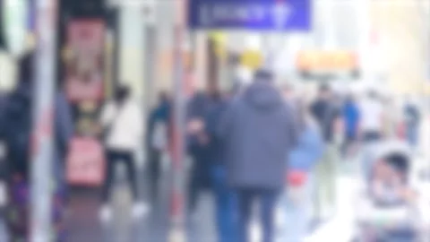 Blurred busy crowd of people walking on sunny urban sidewalk in big city do.. Stock Footage 333826139