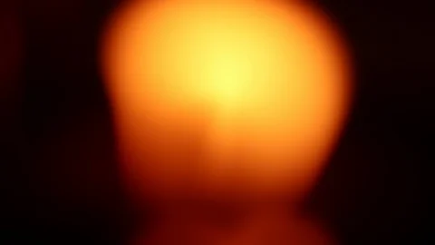 Blurred candle flame blinking in the wind Stock Footage 111013920