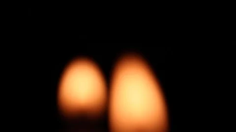 Blurred candle flames blinking in the wind Stock Footage 127566140