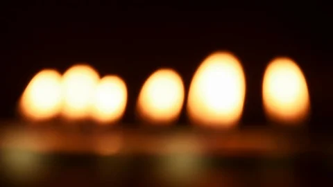 Blurred candlelights in black background Stock Footage 121186794