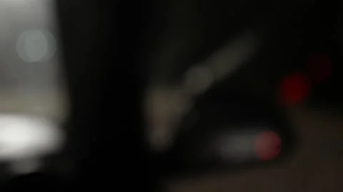 Blurred car flasher, out of focus background suggesting urban nightlife Stock Footage 261945908