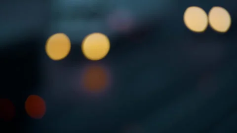Blurred car headlights moving evening highway Bokeh effect. City traffic rush Stock Footage 169968129