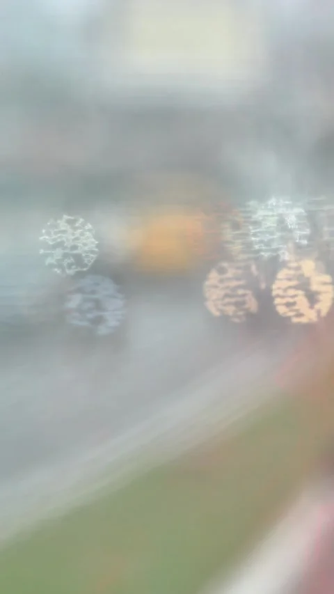 Blurred Car Lights Through Rainy Windshield Vertical Bokeh Abstract 4K Stock Footage 335393173