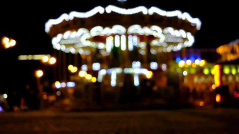 Blurred Carousel. Bokeh Lights Glowing Carousel. Beautiful Dark Park Background Stock Footage 90488494