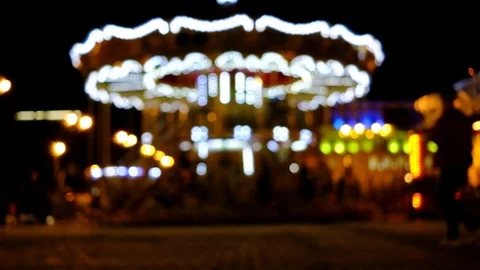 Blurred Carousel. Bokeh Lights Glowing Carousel. Beautiful Dark Park Background Stock Footage 91928147