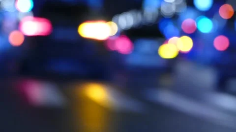 Blurred cars at night, tail lamps and traffic lights, abstract blurry city ro Stock Footage 166320364